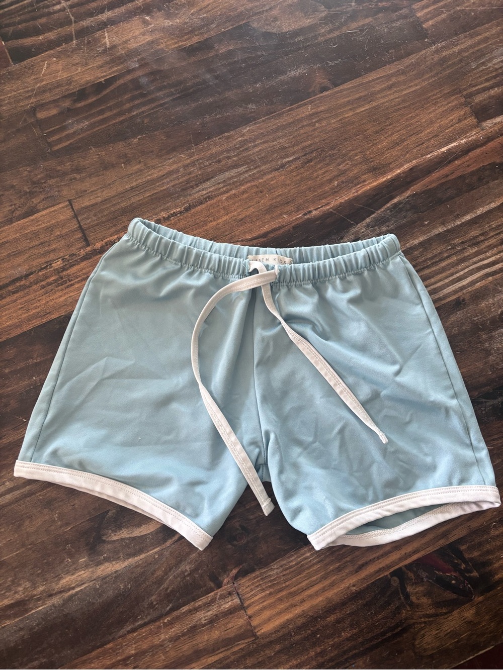 Light Blue Athletic Shorts with White Trim